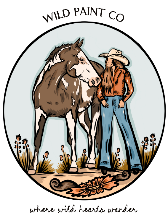 Circular logo for Wild Paint Co featuring a person with a horse and the tagline 'where wild hearts wander'.